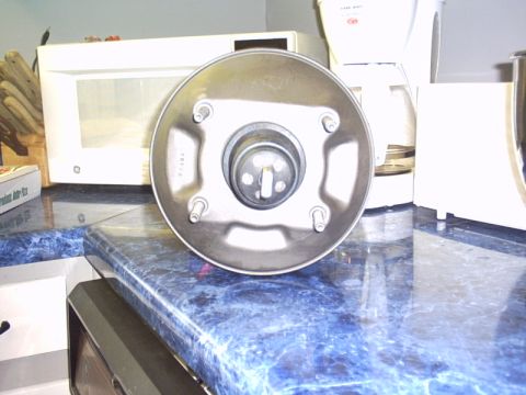 1991 Ford LTD Crown Victoria - A brake booster is shown on a kitchen counter, not a vehicle.