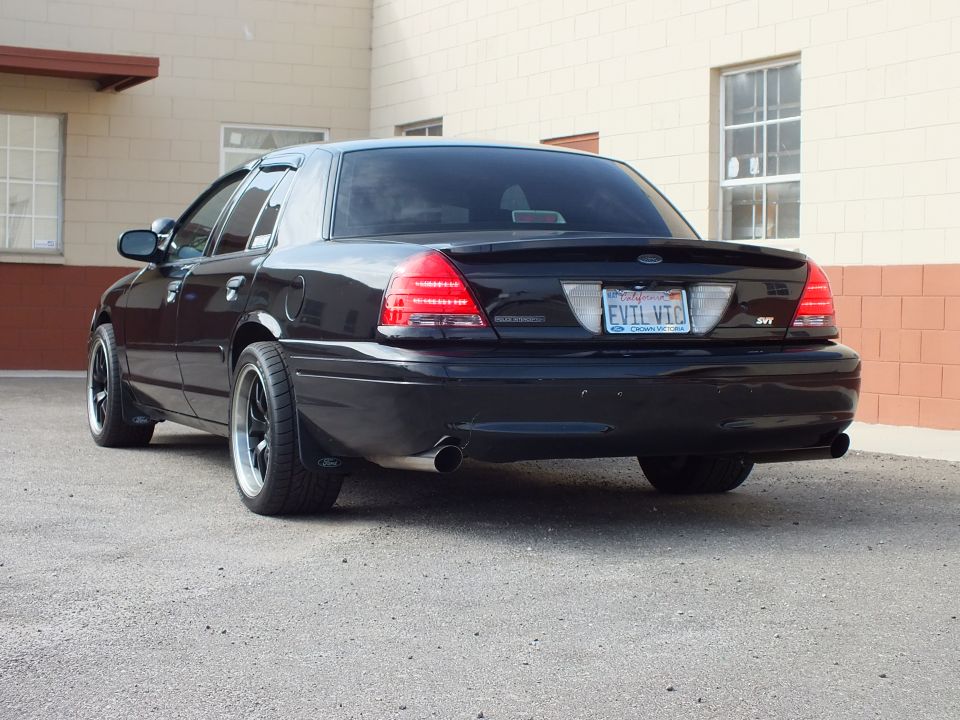 Black Ford Crown Victoria rear, EVIL VIC California plate, SVT badge, dual exhaust