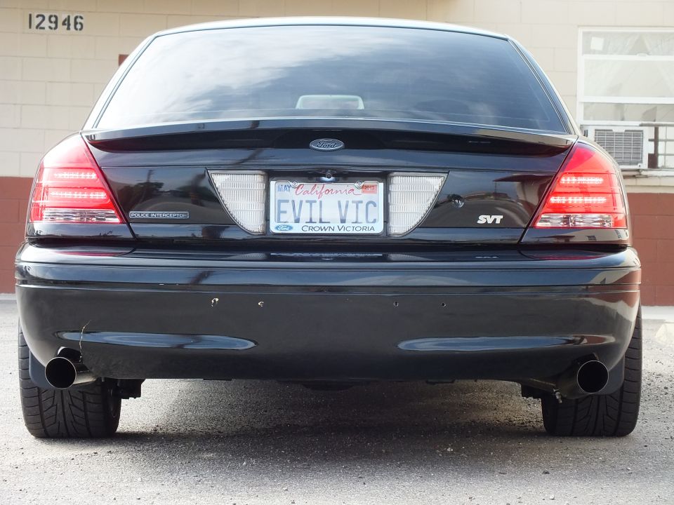 Black Ford Crown Victoria SVT rear with EVIL VIC plate and dual exhaust tips
