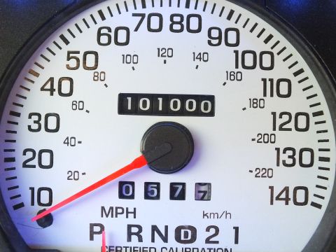 2003 Ford Crown Victoria - Close-up of a vehicle speedometer to 140 mph showing 101000 odometer miles and 0577 trip.