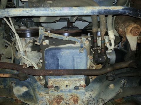 1997 Ford Crown Victoria - This image shows the underside of a vehicle, focusing on engine components like belts and pulleys.