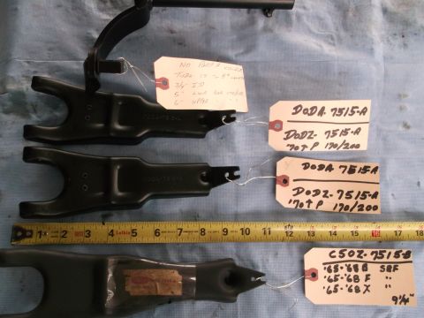 1971 Ford Ranchero - Several clutch fork parts are laid out with identification tags and a measuring tape for size reference.