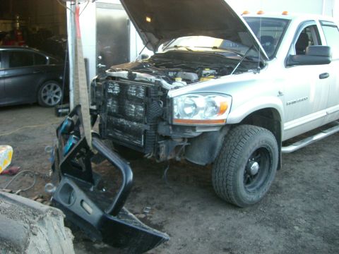 2005 Dodge 3500 - Front bumper removed from a silver 2006 Dodge Ram 3500 during repairs.