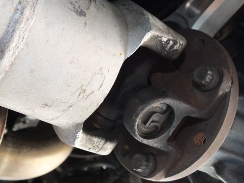 2003 Ford Crown Victoria - U-joint cross and pinion flange bolts detailed at the rear axle connection.