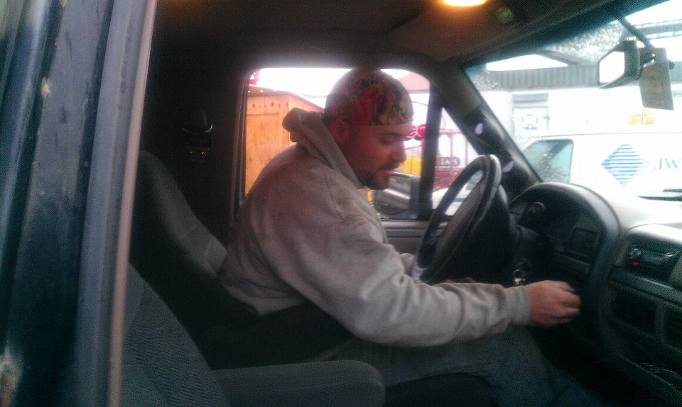 Man starting 1995 Ford Bronco interior, driver's side view