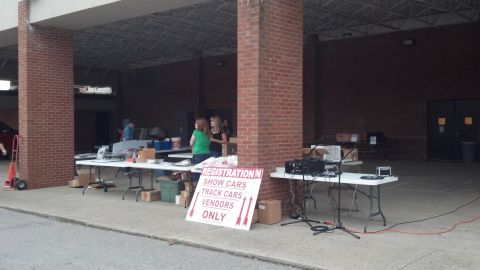 2007 Ford Mustang - Tables are set up for registration at an outdoor event, with signs indicating 'Show Cars', 'Track Cars', and 'Vendors'.