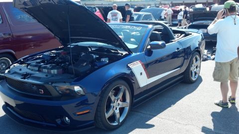 2007 Ford Mustang - Blue 2007 Ford Mustang convertible at a car show with hood open.