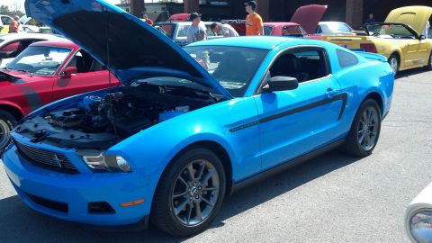 2007 Ford Mustang - Blue Ford Mustang at a car show, hood open to display the engine bay.