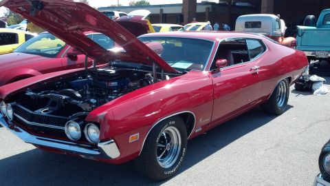 2007 Ford Mustang - A red 1970 Ford Torino GT coupe is displayed with its hood open, revealing the engine bay.