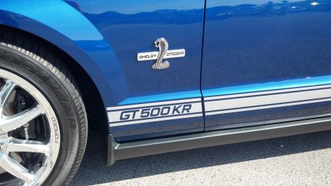 2007 Ford Mustang - Side view of a blue Ford Mustang Shelby GT500KR, identified by its distinctive badging and side stripes.