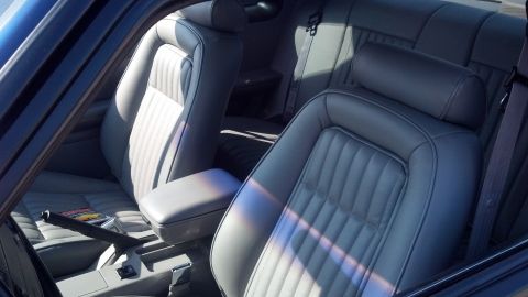 2007 Ford Mustang - Interior view of a car's gray leather seats, including front bucket and rear bench seating.