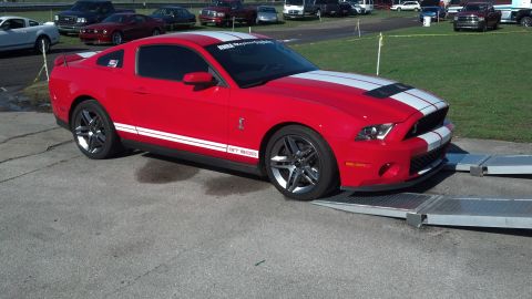2007 Ford Mustang - Red 2007 Ford Mustang GT500 on ramps, with "NMRA" text on windshield banner.