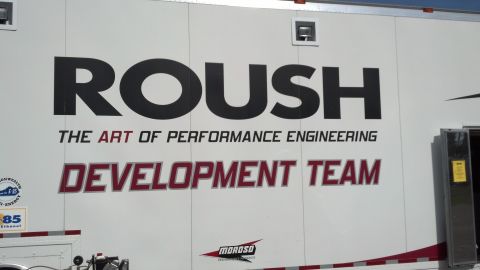 2007 Ford Mustang - A trailer displays ROUSH branding, indicating it's part of their performance engineering development team.