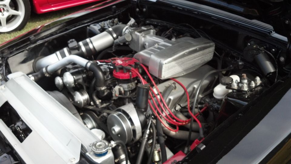 Engine bay with V8 engine, intake, distributor, and radiator