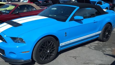 2007 Ford Mustang - Blue Ford Mustang GT500 convertible parked outdoors with other vehicles visible.