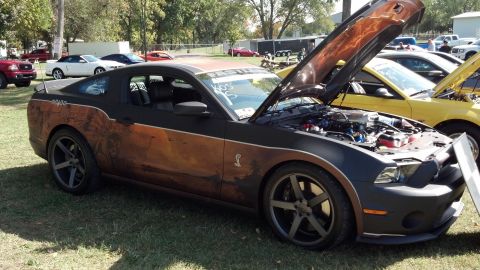 2007 Ford Mustang - A custom painted 2007 Ford Mustang is displayed with its hood open at an outdoor event.