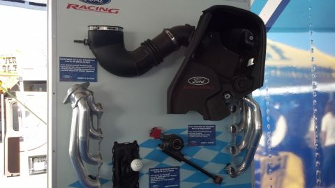 2007 Ford Mustang - Ford Racing parts are displayed, including an air intake system and exhaust headers.