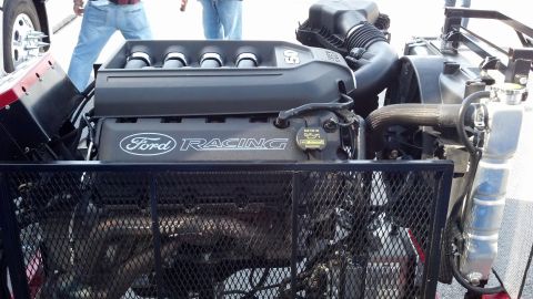 2007 Ford Mustang - Close-up of a Ford Racing engine, likely from a performance vehicle, with visible intake and exhaust components.