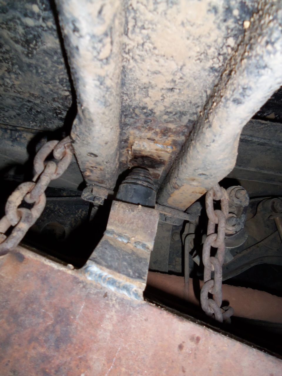 Rear suspension components with chains attached