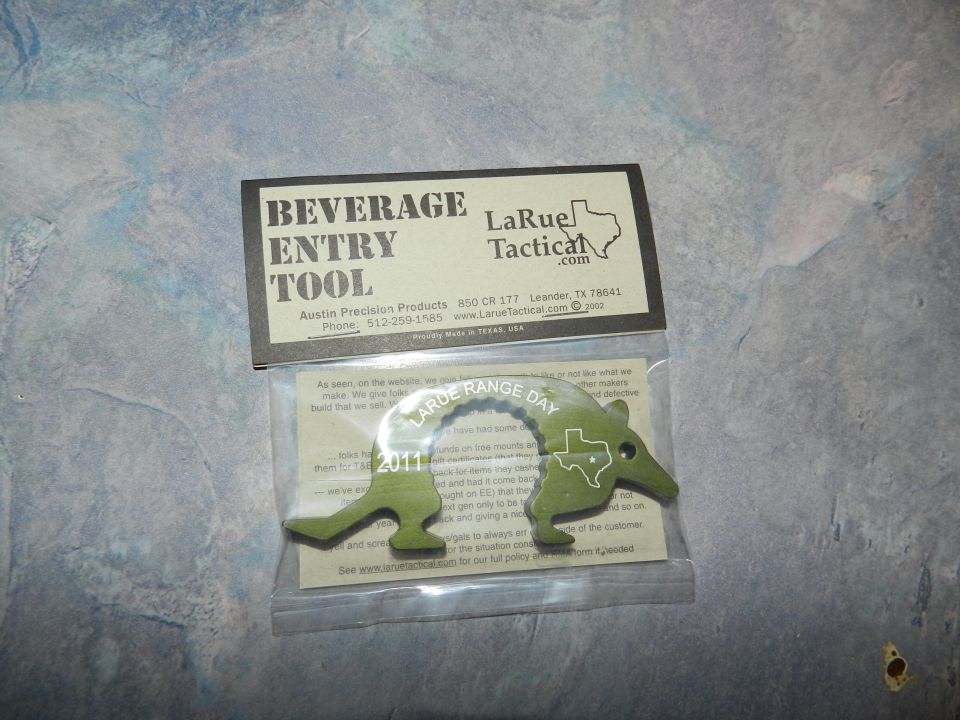 LaRue Tactical beverage entry tool shaped like an armadillo with Texas outline. Text reads 'LARGE RANGE DAY 2011'