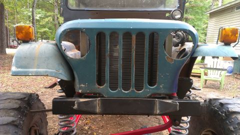 1978 Ford Bronco - Front view of a modified Jeep CJ, showing its distinctive grille and fender details.
