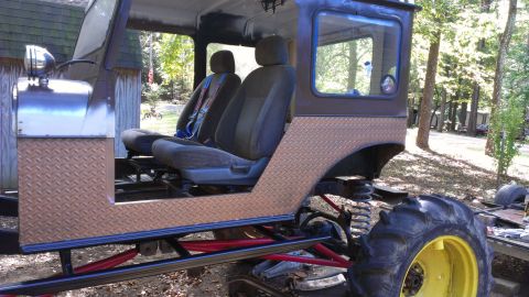 1978 Ford Bronco - This heavily modified vehicle features large tires and custom bodywork, suggesting it's built for off-road use.