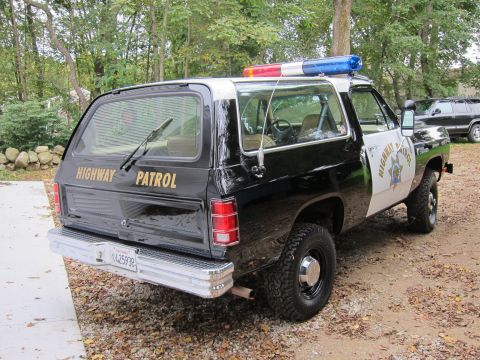 1987 Dodge 1500 - This police SUV has 'HIGHWAY PATROL' text on the rear and side.