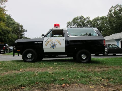 1987 Dodge 1500 - Side view of a black and white 1987 Dodge Ramcharger SUV marked as Highway Patrol.