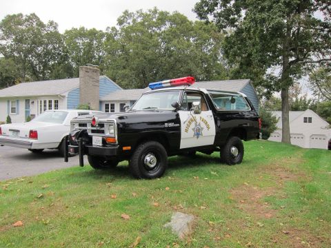 1987 Dodge 1500 - This Dodge Ramcharger is equipped as a police vehicle, complete with a light bar and official markings.