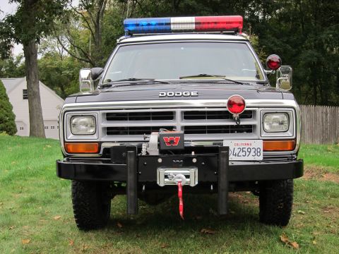 1987 Dodge 1500 - This 1987 Dodge Ram pickup truck features a front-mounted winch and emergency light bar.
