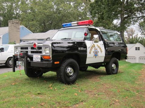 1987 Dodge 1500 - This Dodge Ramcharger is equipped as a police vehicle with a light bar and official markings.