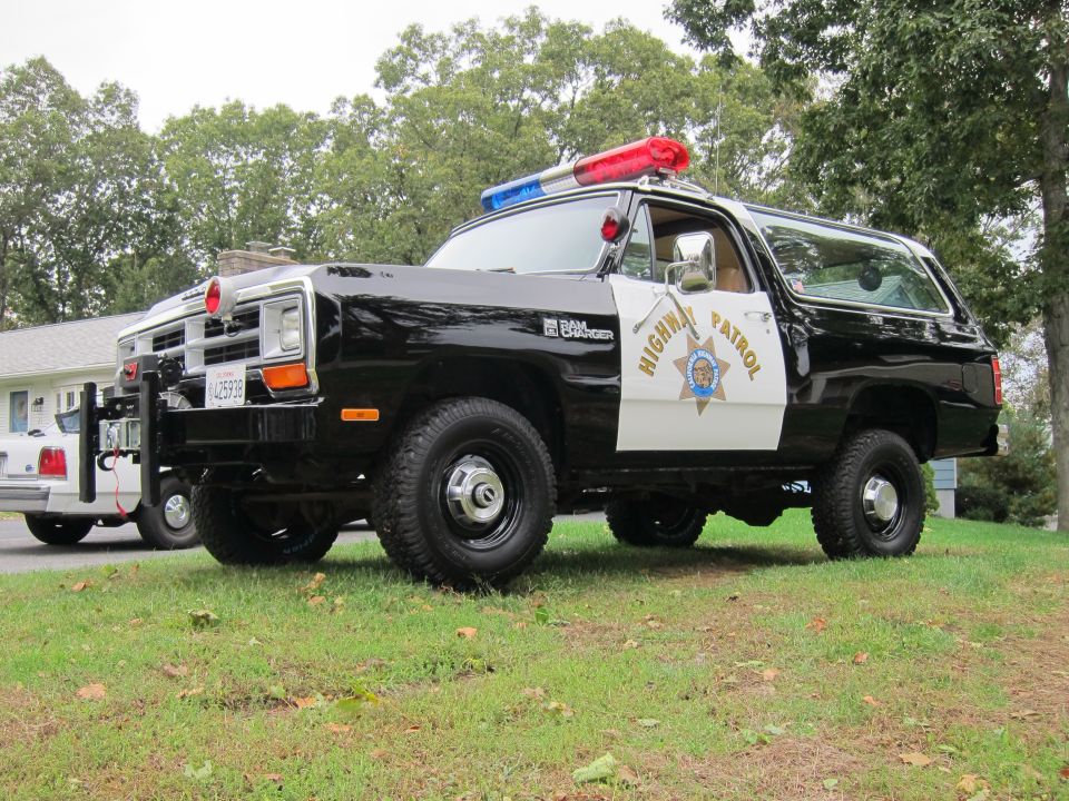 1987 Dodge Ramcharger highway patrol SUV, black and white, with light bar and "Highway Patrol" text