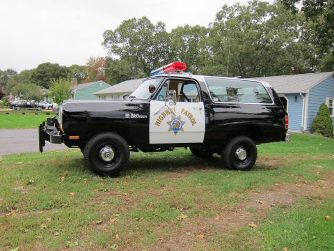 1987 Dodge 1500 - This Dodge Ramcharger is outfitted as a police vehicle, complete with a light bar and official markings.