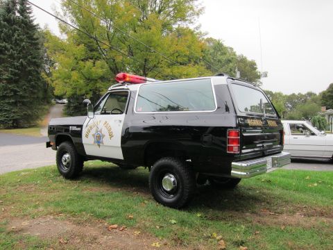 1987 Dodge 1500 - Dodge Ramcharger police vehicle with light bar and "HIGHWAY PATROL" markings.