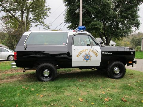 1987 Dodge 1500 - This 1987 Dodge Ramcharger is outfitted as a highway patrol vehicle, a two-tone black and white paint scheme and official markings.