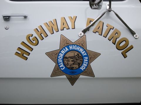 1987 Dodge 1500 - Close-up of the California Highway Patrol emblem and lettering on the side of a vehicle.
