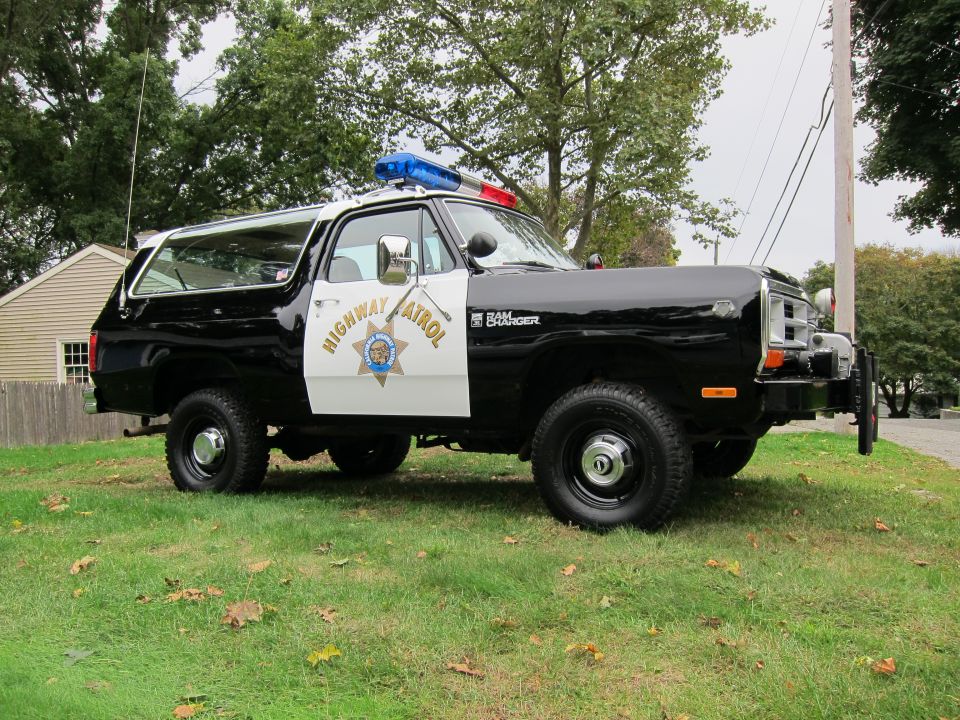 Black and white 1987 Dodge Ramcharger police SUV with "Highway Patrol" text and light bar