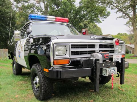 1987 Dodge 1500 - This Dodge Ram truck is outfitted as a police vehicle with a light bar and a front-mounted winch.