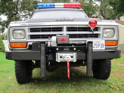 1987 Dodge 1500 - This Dodge pickup truck features a light bar and a winch mounted on the front bumper.
