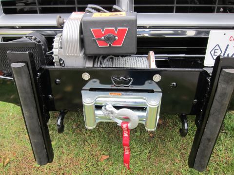 1987 Dodge 1500 - Front bumper with a Warn winch and tow hooks.