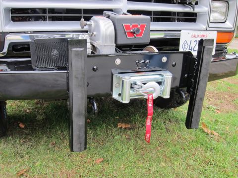 1987 Dodge 1500 - Front view of a truck bumper equipped with a WARN winch and a California license plate.
