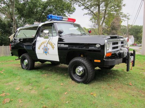 1987 Dodge 1500 - This 1987 Dodge Ramcharger police SUV is marked 'Highway Patrol' and equipped with a light bar.
