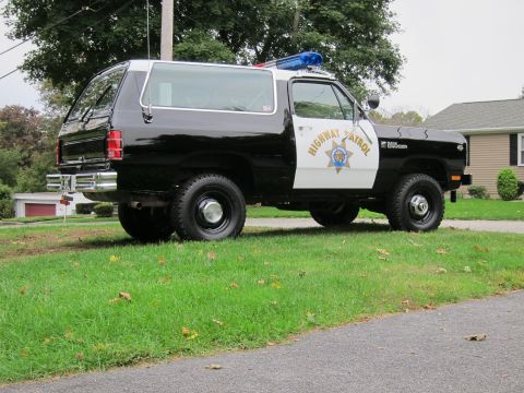 1987 Dodge 1500 - This Dodge Ramcharger is outfitted as a Highway Patrol vehicle with a light bar and official markings.