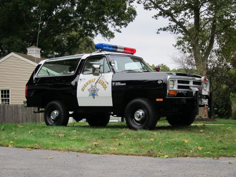 1987 Dodge 1500 - This Dodge Ramcharger SUV is outfitted as a police vehicle with a light bar and official markings.