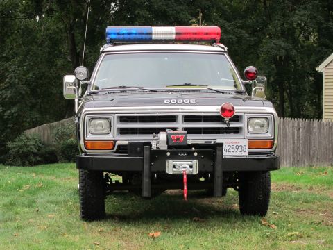 1987 Dodge 1500 - This Dodge Ramcharger is equipped with a light bar and a winch, suggesting it may be used for emergency or off-road purposes.