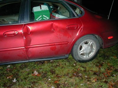 1997 Ford Taurus - This 1997 Ford Taurus has severe damage to its rear passenger side door.