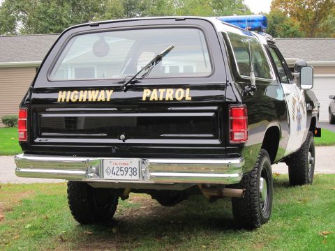 1987 Dodge 1500 - Rear view of a black Dodge Ramcharger marked "HIGHWAY PATROL" with California plates.
