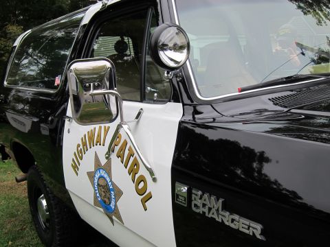 1987 Dodge 1500 - This Ramcharger has "HIGHWAY PATROL" text and a badge on its door.
