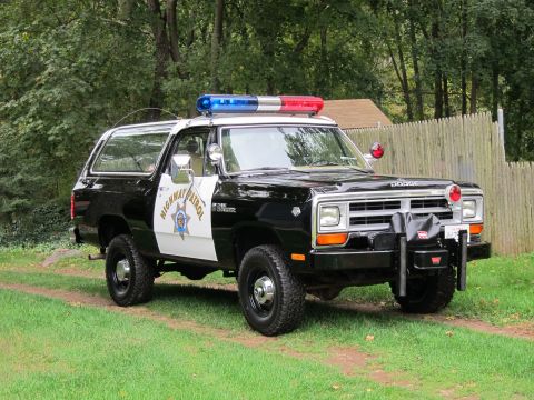 1987 Dodge 1500 - This Dodge Ramcharger is outfitted as a police vehicle, complete with a light bar and siren.
