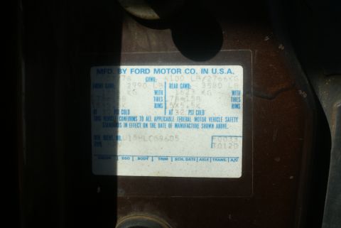 1978 Ford Bronco - Close-up of a 1978 Ford Bronco's VIN sticker, detailing its specifications and manufacturing information.